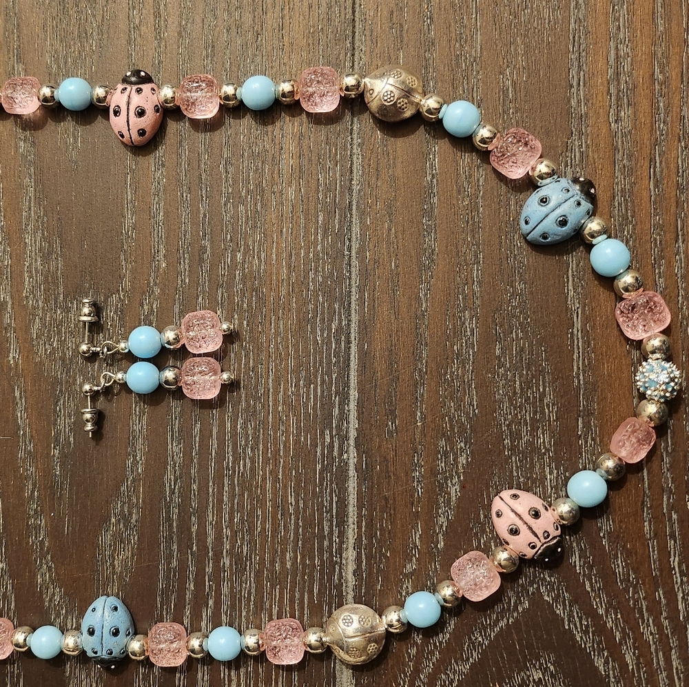 24" light blue/pink ladybug necklace with earrings